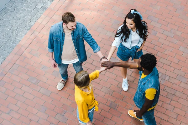 Overhead View Positive Multicultural Friends Putting Hands Together — Stock Photo, Image