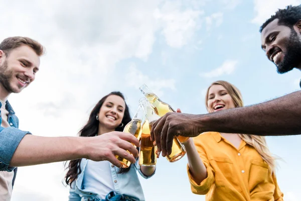Low Angle View Cheerful Multicultural Men Women Clinking Bottles Beer — Stock Photo, Image