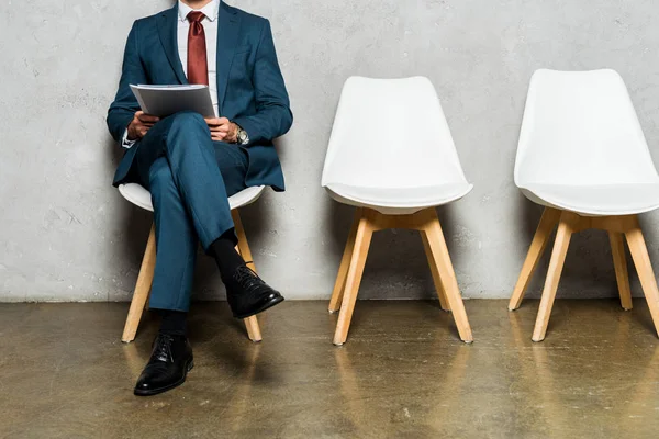 Cropped View Man Sitting White Chair Holding Folder — Stock Photo, Image