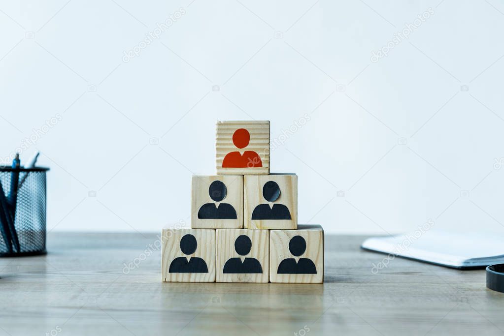 wooden cubes as human resources strategy near stationery on desk 