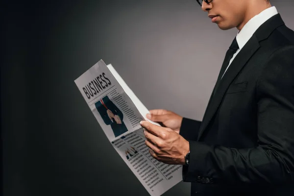 Cropped View African American Businessman Reading Business Newspaper Dark Background — Stock Photo, Image