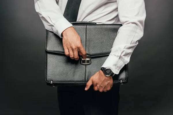 Cropped View African American Businessman Holding Leather Briefcase Dark Background — Stock Photo, Image