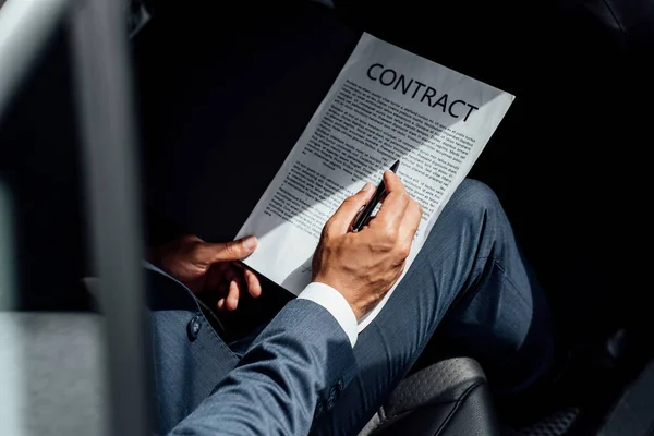 Partial View African American Businessman Suit Reading Contract Car — Stock Photo, Image