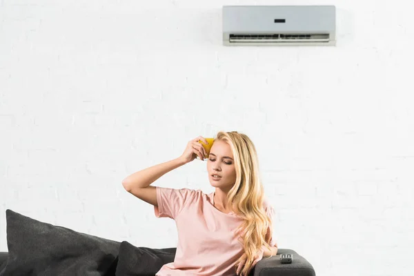 Beautiful Woman Suffering Heat Couch Air Conditioner Home — Stock Photo, Image