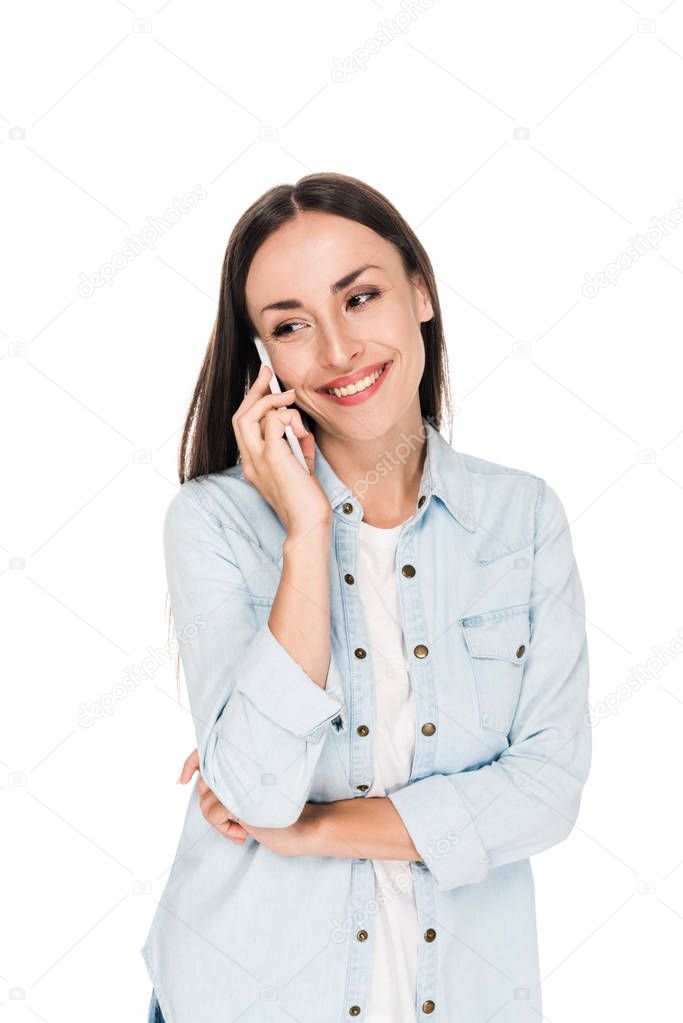 smiling young woman talking on smartphone isolated on white