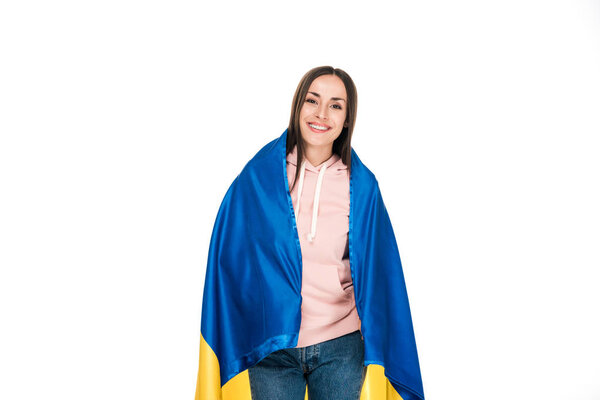 happy young girl holding satin flag of Ukraine isolated on white