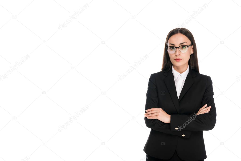 confident businesswoman in black suit with crossed arms isolated on white