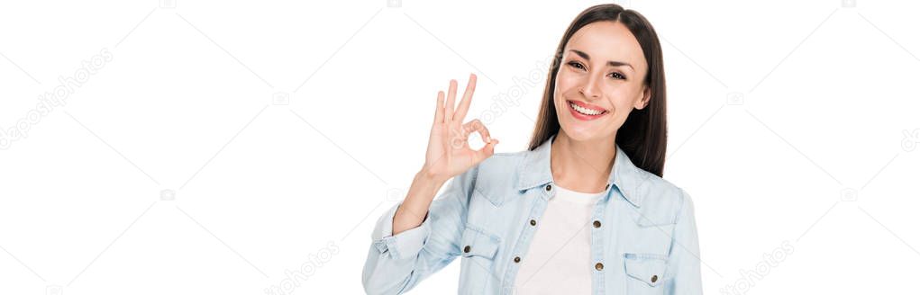smiling brunette woman showing ok sign isolated on white, panoramic shot