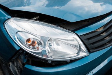 selective focus of headlight in damaged vehicle after car accident  clipart