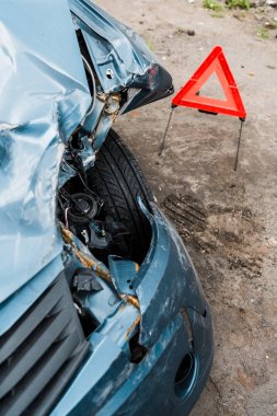 selective focus of crashed blue car after car accident  clipart