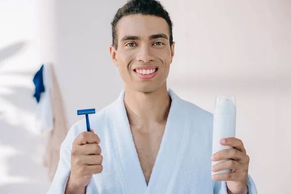 Handsome Young Man Bathrobe Holding Razor Dispenser Shaving Cream While — Stock Photo, Image