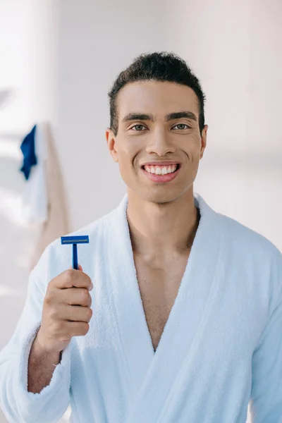 Handsome Young Man Bathrobe Holding Razor Shaving While Smiling Looking — Stock Photo, Image