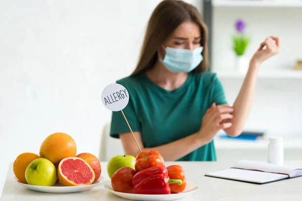 Selective Focus Woman Medical Mask Scratching While Sitting Table Vegetables — Stock Photo, Image