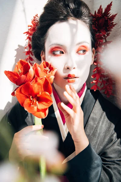 Selective Focus Sakura Branches Beautiful Geisha Holding Red Flowers Sunlight — Stock Photo, Image
