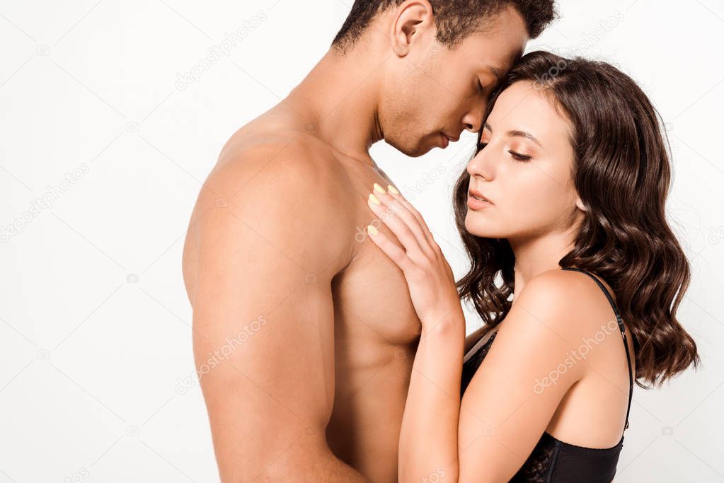 sexy shirtless man with closed eyes near beautiful girl isolated on white 