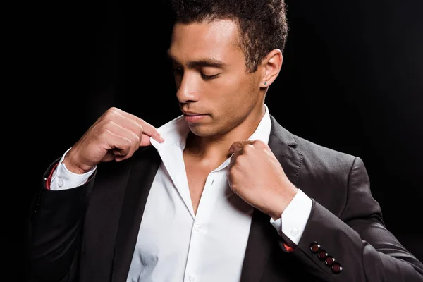 Handsome Mixed Race Man Touching White Shirt Isolated Black — Stock Photo, Image