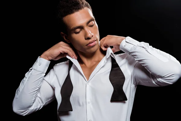 Handsome Mixed Race Man Standing Touching Tie Isolated Black — Stock Photo, Image