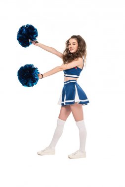 full length view of smiling cheerleader girl in blue uniform dancing with pompoms isolated on white clipart