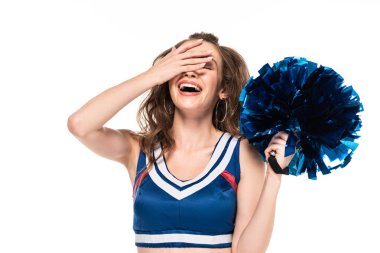 happy cheerleader girl in blue uniform holding pompom and laughing with facepalm isolated on white clipart