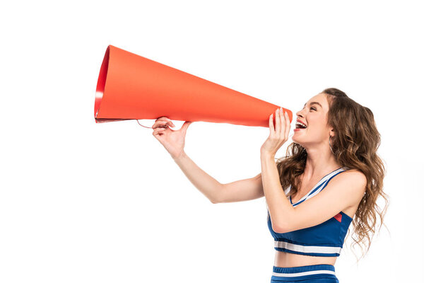 happy cheerleader girl in blue uniform with pompom using orange megaphone isolated on white