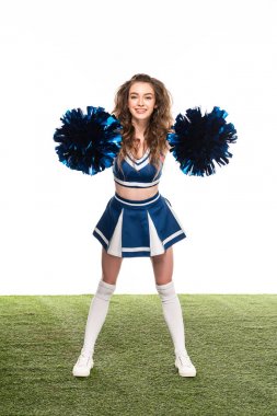 happy cheerleader girl in blue uniform dancing with pompoms on green field isolated on white clipart