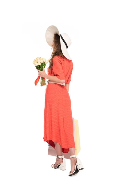 Vista Trasera Mujer Elegante Sombrero Vestido Sosteniendo Tulipanes Blancos Bolsas — Foto de Stock