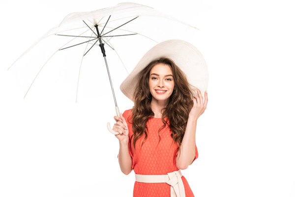 happy elegant woman in hat and dress holding transparent umbrella isolated on white