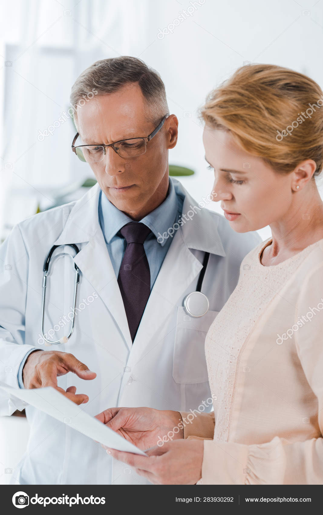 Doctor Glasses Pointing Finger Document Woman — Stock Photo © IgorVetushko #283930292 Doctor Glasses Pointing Finger Document... 