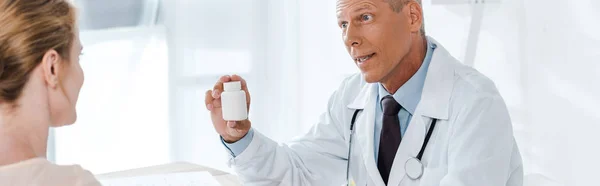 Panoramic Shot Doctor Holding Bottle Looking Patient — Stock Photo, Image