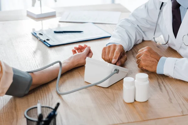 Cropped View Doctor Measuring Blood Pressure Woman Bottles — Stock Photo, Image