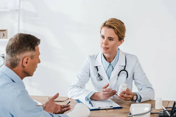 Selective Focus Attractive Doctor Looking Man Broken Arm While Holding — Stock Photo, Image