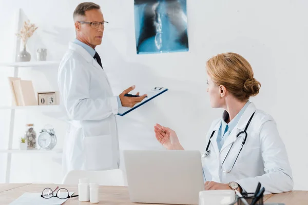 Handsome Doctor Standing Ray Looking Colleague — Stock Photo, Image