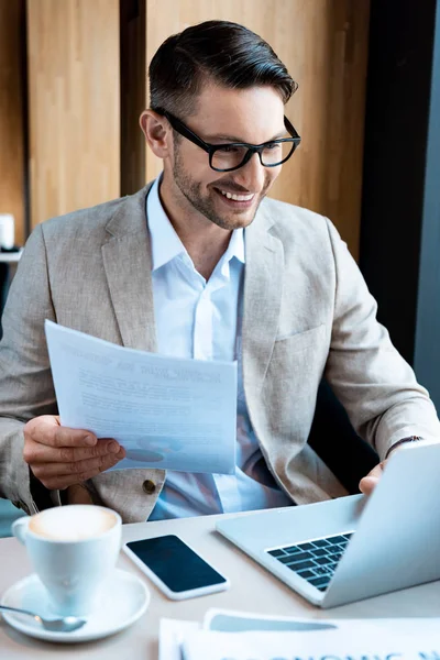 Smiling Businessman Glasses Holding Document Typing Laptop Keyboard Cafe — Stock Photo, Image