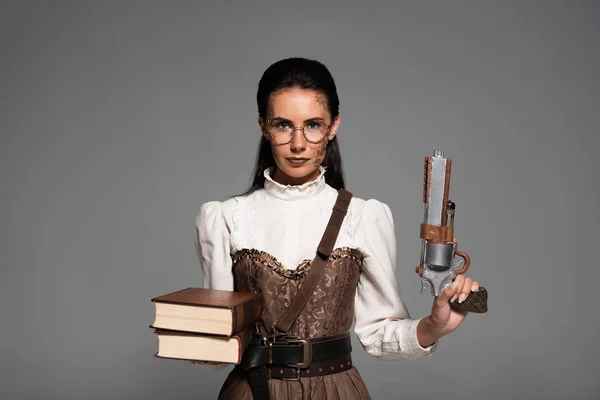 Front View Steampunk Woman Holding Books Vintage Pistol Isolated Grey — Stock Photo, Image