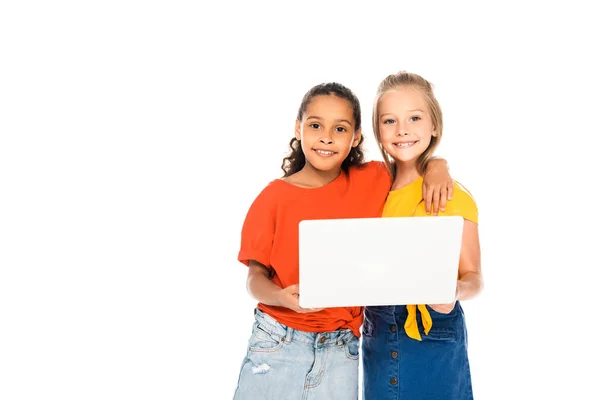 Two Happy Multicultural Friends Smiling Camera While Using Laptop Together — Stock Photo, Image