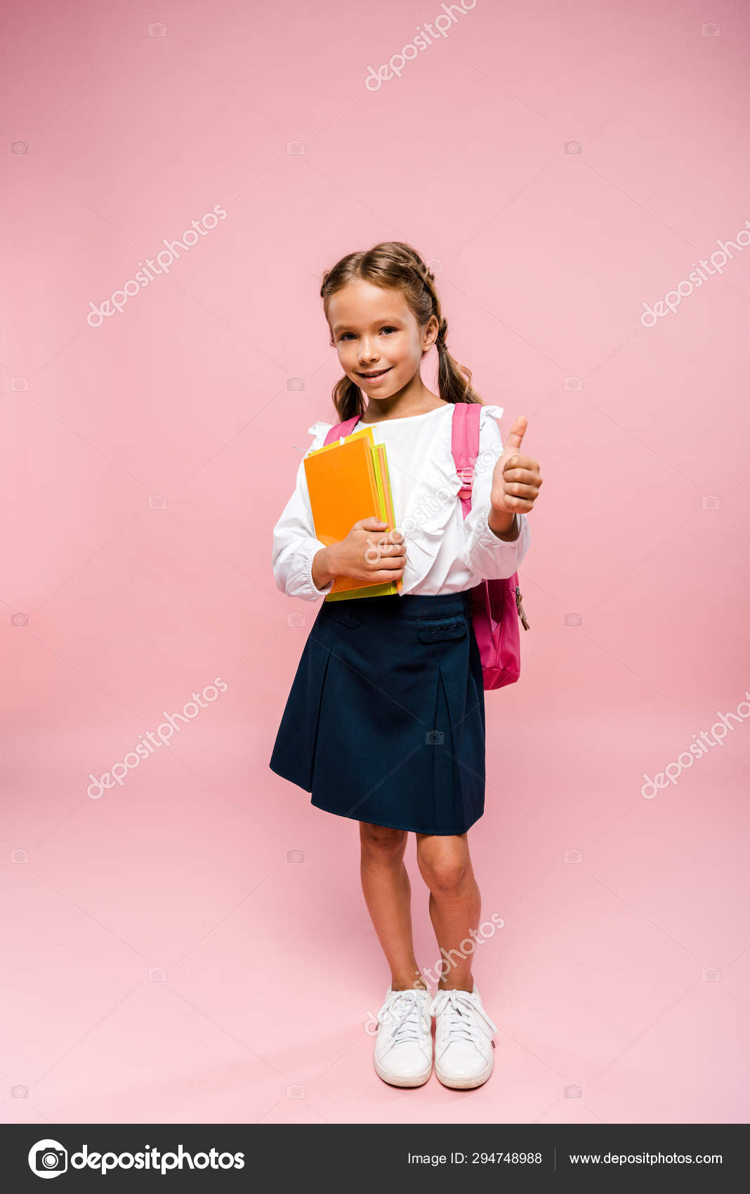 kid holding backpack