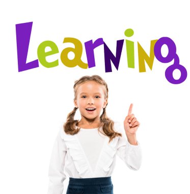 happy kid pointing with finger at learning lettering on white  clipart