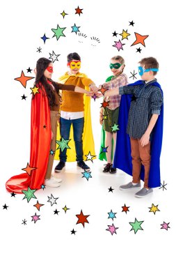 happy kids in superhero costumes and masks stacking hands near stars on white  clipart