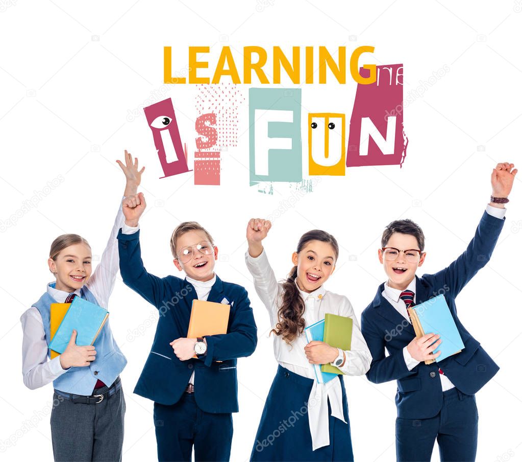 happy schoolchildren with outstretched hands holding books near learning is fun letters on white 