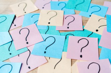 selective focus of question marks on colorful sticky notes  clipart