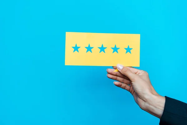 Woman Holding Yellow Paper Stars Isolated Blue — Stock Photo, Image