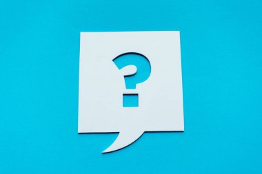 top view of question mark on white speech bubble isolated on blue  clipart