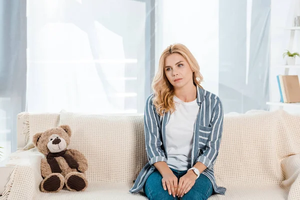 Upset Woman Sitting Sofa Soft Toy Home — Stock Photo, Image