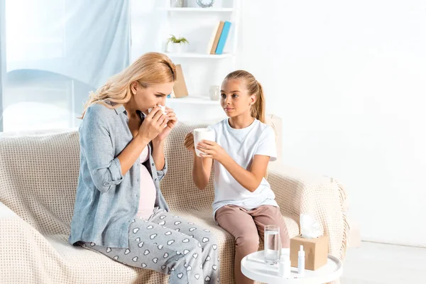 Cute Kid Holding Cup Mother Sneezing Tissue — Stock Photo, Image