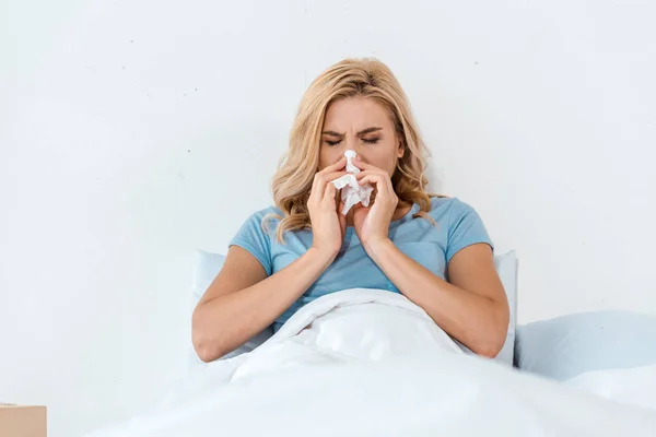 Sick Woman Sneezing Napkin While Lying Bed — Stock Photo, Image