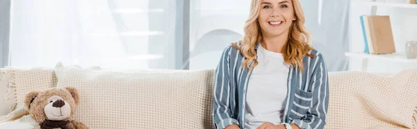 Panoramic Shot Cheerful Woman Looking Camera While Sitting Teddy Bear — Stock Photo, Image