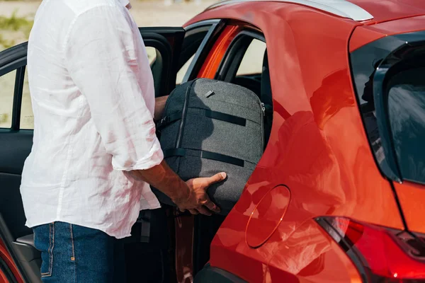 Cropped View Man Shirt Putting Backpack Car — Stock Photo, Image