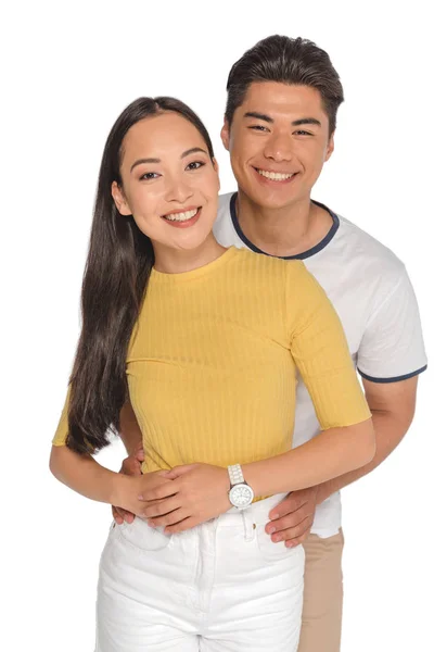 Happy Asian Man Embracing Attractive Girlfriend While Smiling Camera Isolated — Stock Photo, Image