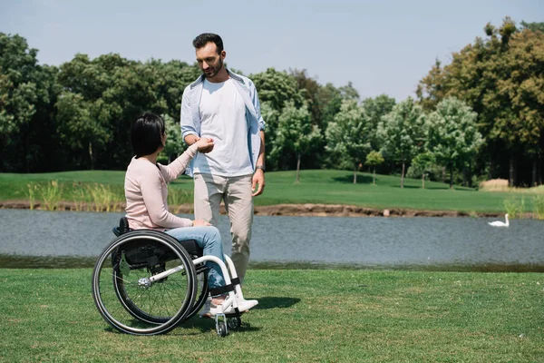 Cheerful Young Man Holding Hands Disabled Girlfriend While Resting Pond — Stock Photo, Image