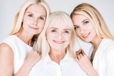 portrait of three generation blonde women isolated on grey clipart